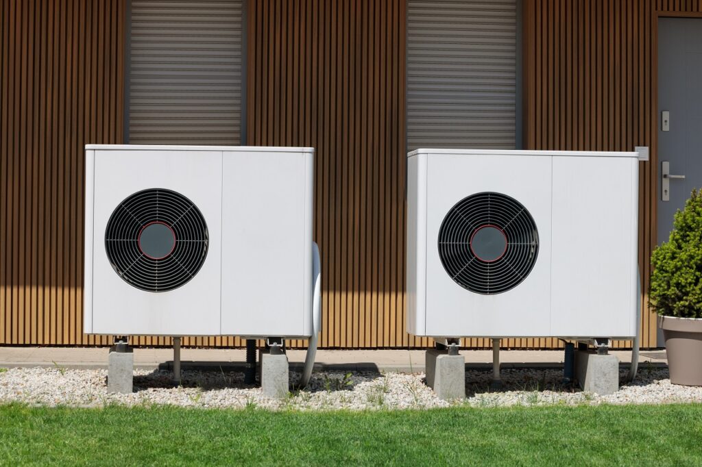 Two heat pump units installed outside a building